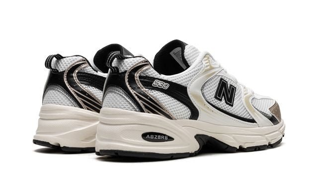 New Balance 530 Blanco Dorado Negro